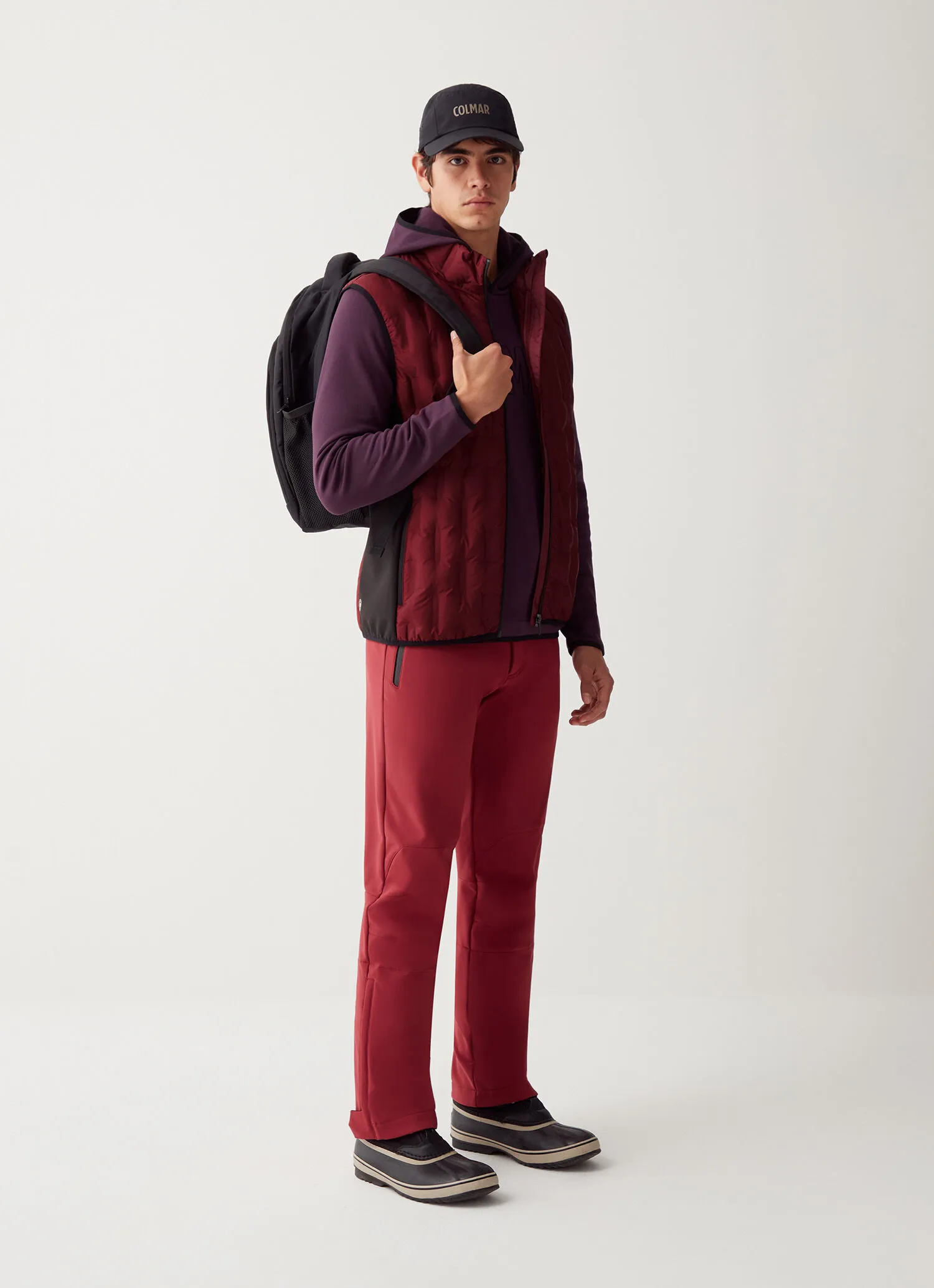 Down-padded gilet with softshell inserts