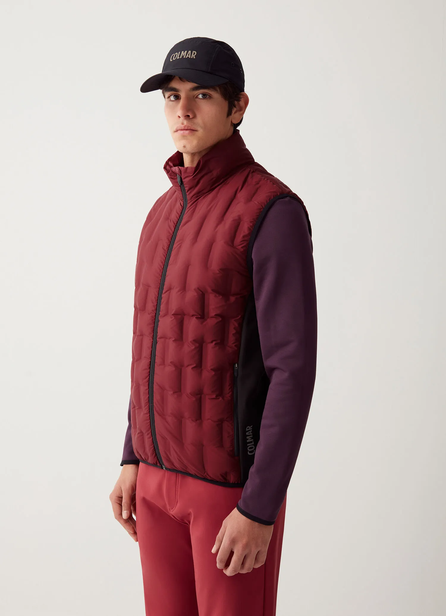 Down-padded gilet with softshell inserts