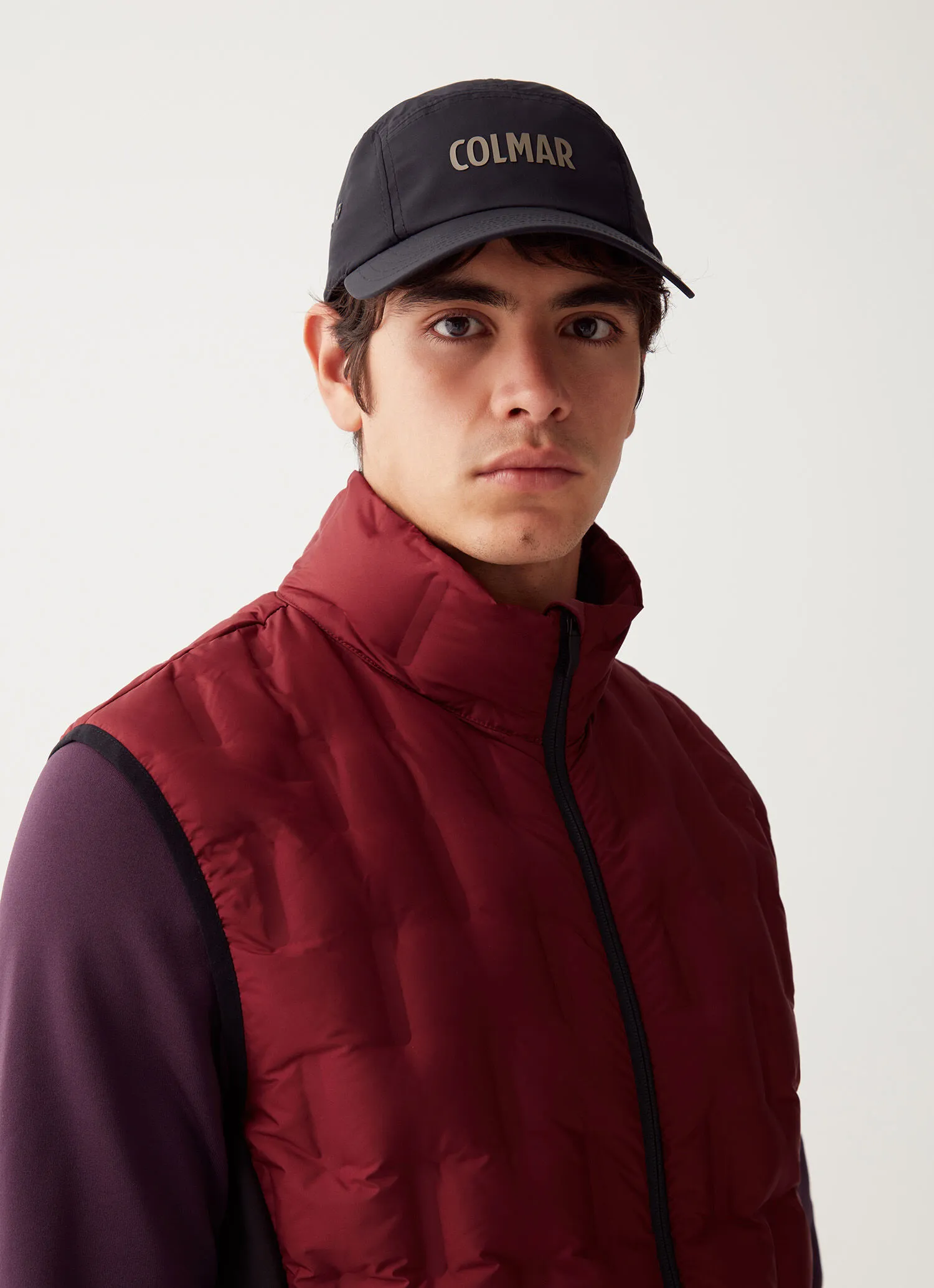 Down-padded gilet with softshell inserts